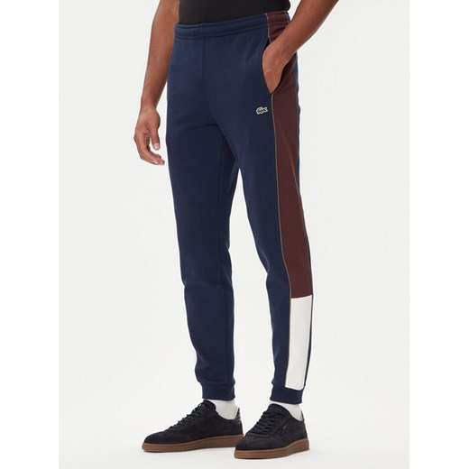 Lacoste Spodnie dresowe XH5923 Granatowy Regular Fit ze sklepu MODIVO w kategorii Spodnie męskie - zdjęcie 185627338