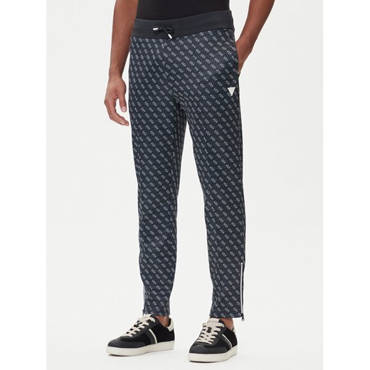 Guess Spodnie dresowe Z2BB05 K7122 Granatowy Regular Fit ze sklepu MODIVO w kategorii Spodnie męskie - zdjęcie 185635055