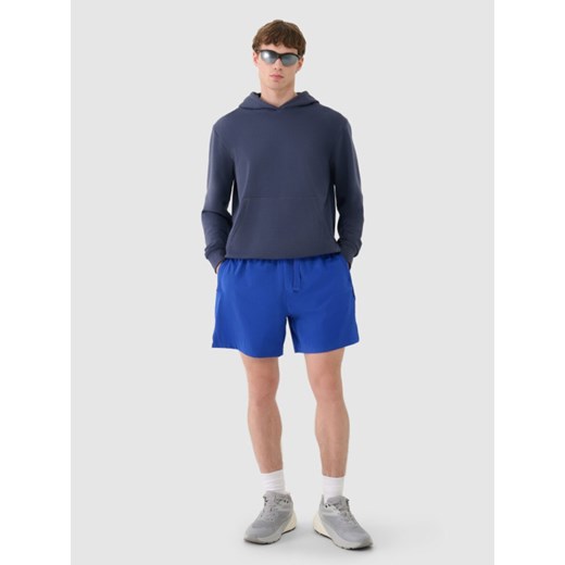 Męskie spodenki casual 4F 4FWSS25TSHOM533  - niebieskie ze sklepu Sportstylestory.com w kategorii Spodenki męskie - zdjęcie 185641407