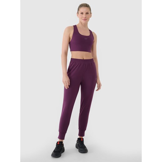 Damskie spodnie treningowe 4F 4FRSS25TFTRF0789 - fioletowe ze sklepu Sportstylestory.com w kategorii Spodnie damskie - zdjęcie 185670855