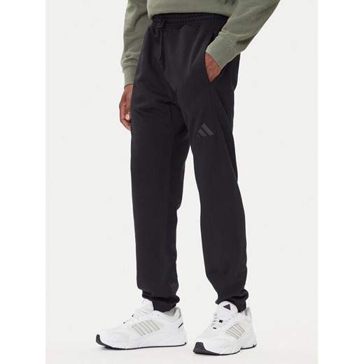 adidas Spodnie dresowe ALL SZN Fleece IX1246 Czarny Tapered Leg ze sklepu MODIVO w kategorii Spodnie męskie - zdjęcie 185724097