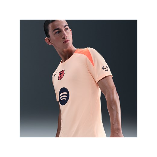 Męska koszulka piłkarska z dzianiny Nike Dri-FIT Total 90 FC Barcelona Strike (wersja trzecia) - Pomarańczowy ze sklepu Nike poland w kategorii T-shirty męskie - zdjęcie 185745879