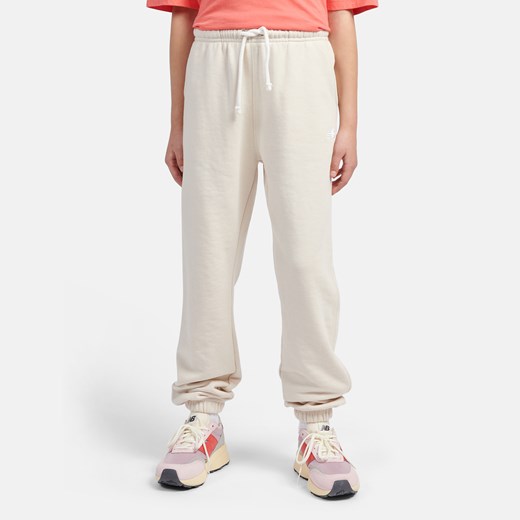Spodnie dziecięce New Balance LAKG0058LIN – beżowe ze sklepu New Balance Poland w kategorii Spodnie chłopięce - zdjęcie 185753299