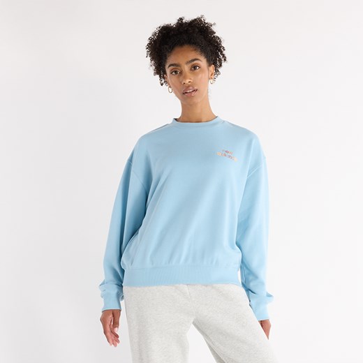 Bluza damska New Balance WT43559CUH – niebieska ze sklepu New Balance Poland w kategorii Bluzy damskie - zdjęcie 185753308
