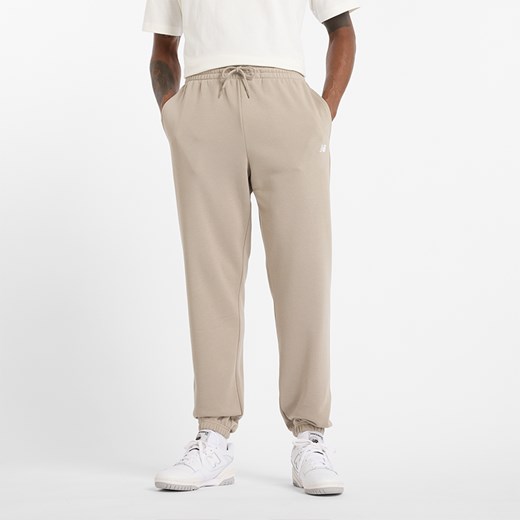 Spodnie męskie New Balance MP41519ADS – beżowe ze sklepu New Balance Poland w kategorii Spodnie męskie - zdjęcie 185753566