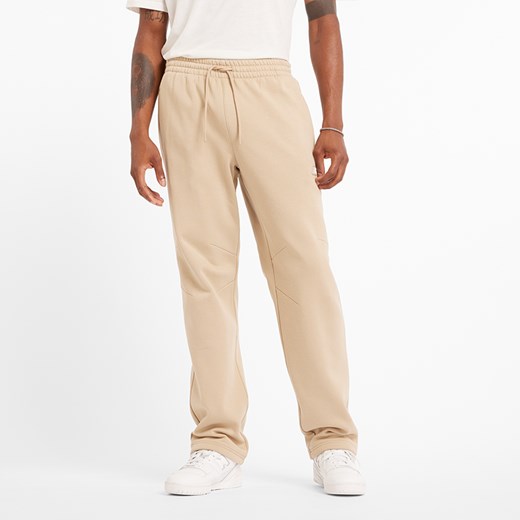 Spodnie męskie New Balance MP44587SNW – beżowe ze sklepu New Balance Poland w kategorii Spodnie męskie - zdjęcie 185753856