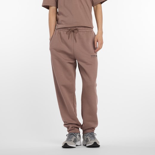 Spodnie męskie New Balance MP53508EAS – brązowe ze sklepu New Balance Poland w kategorii Spodnie męskie - zdjęcie 185754109