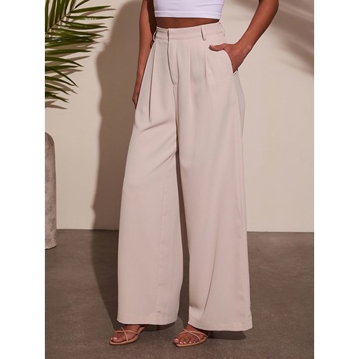 LA Angels Spodnie w kolorze kremowym La Angels XL wyprzedaż Limango Polska