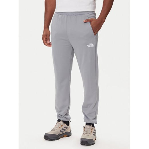 The North Face Spodnie dresowe Reaxion 2.0 NF0A8DRS Szary Regular Fit ze sklepu MODIVO w kategorii Spodnie męskie - zdjęcie 185820518