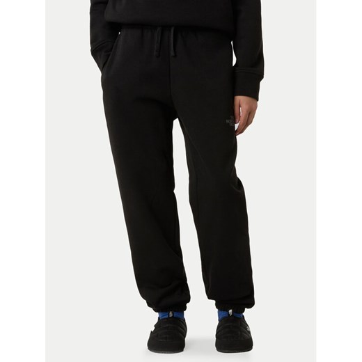 The North Face Spodnie dresowe NF0A8EAU Czarny Relaxed Fit ze sklepu MODIVO w kategorii Spodnie chłopięce - zdjęcie 185833649