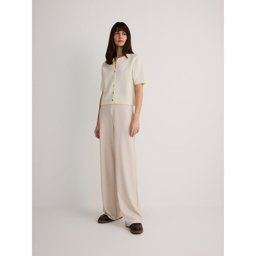 Reserved - Spodnie z szerokimi nogawkami - beżowy Reserved S wyprzedaż Reserved