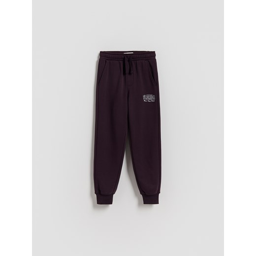 Reserved - Bawełniane spodnie jogger - fioletowy ze sklepu Reserved w kategorii Spodnie chłopięce - zdjęcie 185944769