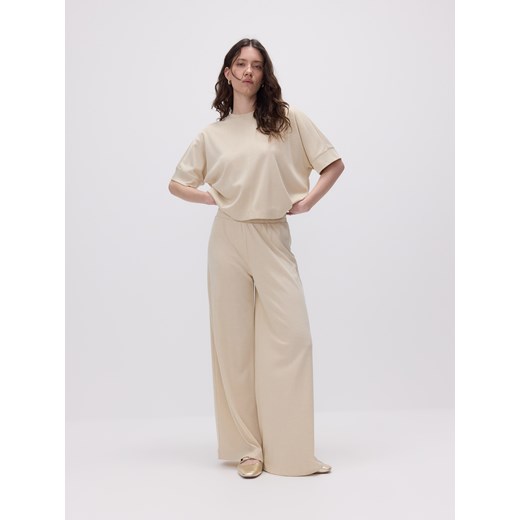 Reserved - Luźne spodnie z wiskozą - kremowy ze sklepu Reserved w kategorii Spodnie damskie - zdjęcie 185950988