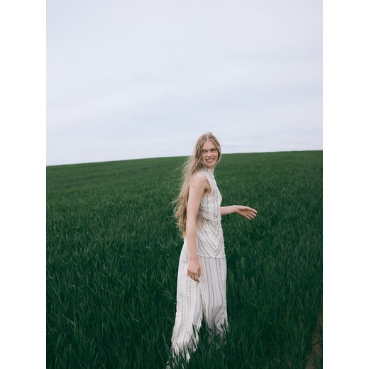 Reserved - Luźne spodnie z metalizowaną nitką - beżowy ze sklepu Reserved w kategorii Spodnie damskie - zdjęcie 186009016