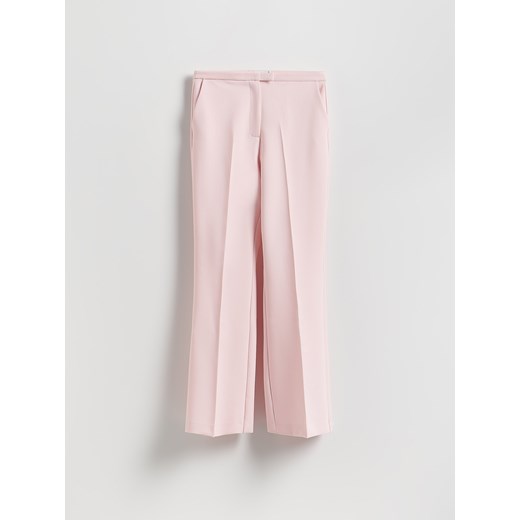 Reserved - Spodnie z kantem - pastelowy róż ze sklepu Reserved w kategorii Spodnie damskie - zdjęcie 186027495