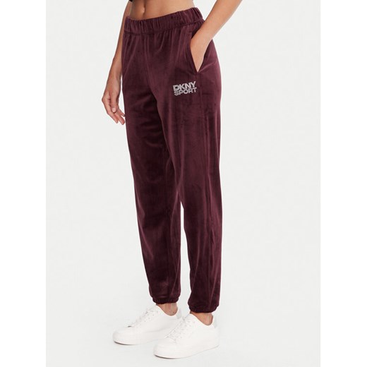 DKNY Sport Spodnie dresowe DP5P3702 Bordowy Regular Fit ze sklepu MODIVO w kategorii Spodnie damskie - zdjęcie 186029278