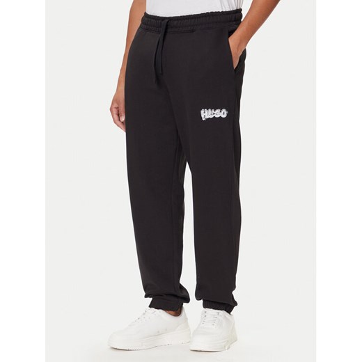 HUGO Spodnie dresowe Nyrotro 50549779 Czarny Loose Fit ze sklepu MODIVO w kategorii Spodnie męskie - zdjęcie 186029927