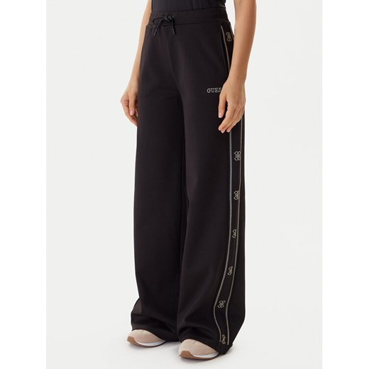 Guess Spodnie dresowe V5BB12 KCX22 Czarny Wide Leg ze sklepu MODIVO w kategorii Spodnie damskie - zdjęcie 186030279