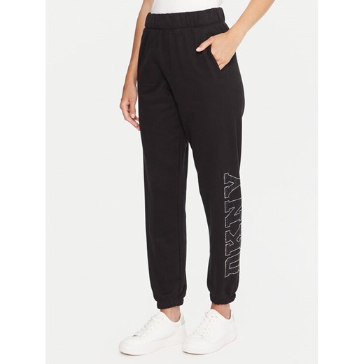 DKNY Sport Spodnie dresowe DP5P3737 Czarny Regular Fit ze sklepu MODIVO w kategorii Spodnie damskie - zdjęcie 186032185
