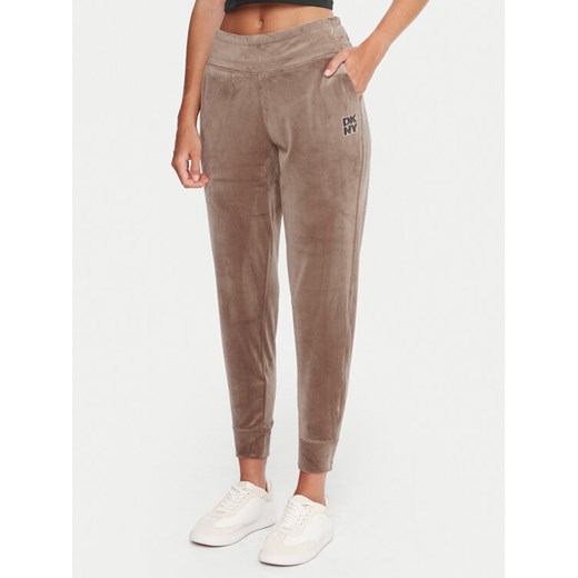 DKNY Sport Spodnie dresowe DP5P3710 Beżowy Regular Fit ze sklepu MODIVO w kategorii Spodnie damskie - zdjęcie 186032207