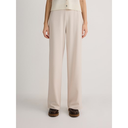 Reserved - Spodnie z szerokimi nogawkami - beżowy Reserved M wyprzedaż Reserved