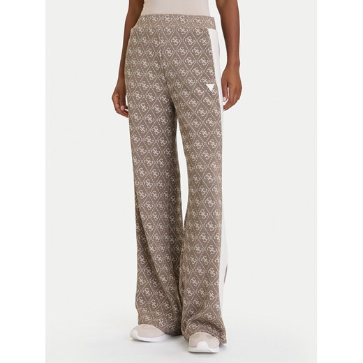Guess Spodnie dresowe V5BB15 K1990 Brązowy Relaxed Fit ze sklepu MODIVO w kategorii Spodnie damskie - zdjęcie 186186806
