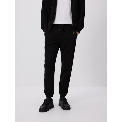 Reserved - Spodnie dresowe regular fit - czarny ze sklepu Reserved w kategorii Spodnie męskie - zdjęcie 186188217
