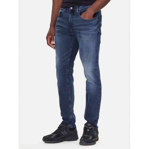 Tommy Jeans Jeansy DM0DM22247 Granatowy Slim Fit ze sklepu MODIVO w kategorii Jeansy męskie - zdjęcie 186200528