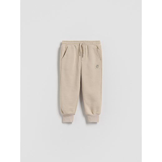 Reserved - Dresowe joggery - beżowy ze sklepu Reserved w kategorii Spodnie chłopięce - zdjęcie 186227757