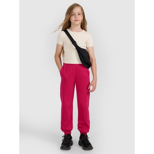Dziewczęce spodnie dresowe 4F 4FJWAW25TTROF1242 - różowe ze sklepu Sportstylestory.com w kategorii Spodnie dziewczęce - zdjęcie 186230179