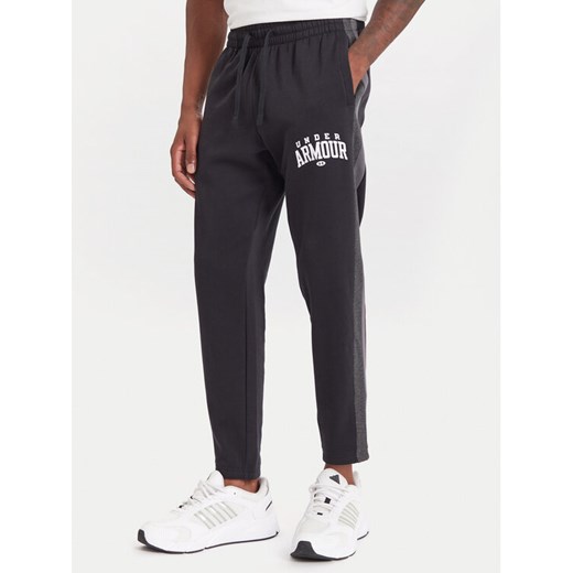 Under Armour Spodnie dresowe Ua Rival Fleece Colorblock 6003954 Czarny Loose Fit ze sklepu MODIVO w kategorii Spodnie męskie - zdjęcie 186267446