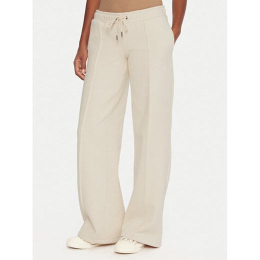 Guess Jeans Spodnie dresowe W5BB04 KC811 Beżowy Wide Leg ze sklepu MODIVO w kategorii Spodnie damskie - zdjęcie 186267707