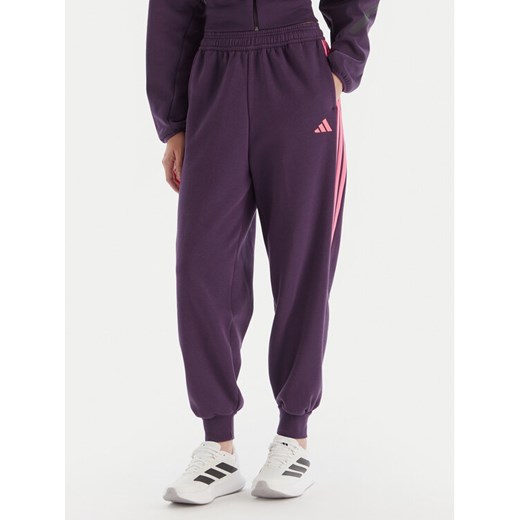 adidas Spodnie dresowe Tiro 3-Stripes JM9072 Fioletowy Loose Fit ze sklepu MODIVO w kategorii Spodnie damskie - zdjęcie 186294728