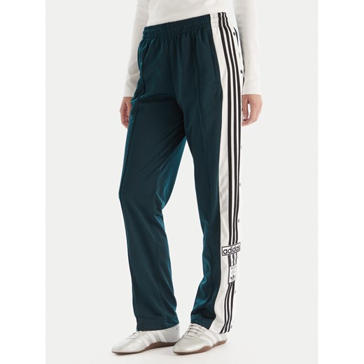 adidas Spodnie dresowe Adibreak JV7515 Zielony Loose Fit ze sklepu MODIVO w kategorii Spodnie damskie - zdjęcie 186294798
