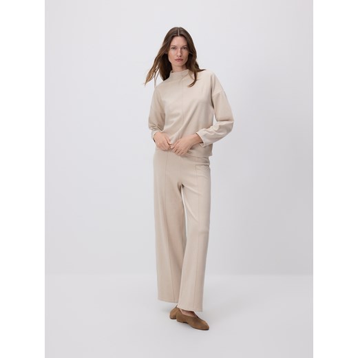 Reserved - Spodnie z przeszyciem - kremowy ze sklepu Reserved w kategorii Spodnie damskie - zdjęcie 186312869