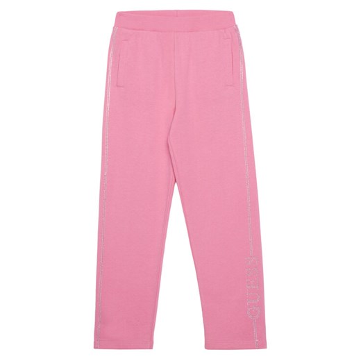 Guess Spodnie dresowe J5YQ12 KA6R4 Różowy Regular Fit ze sklepu MODIVO w kategorii Spodnie dziewczęce - zdjęcie 186323445