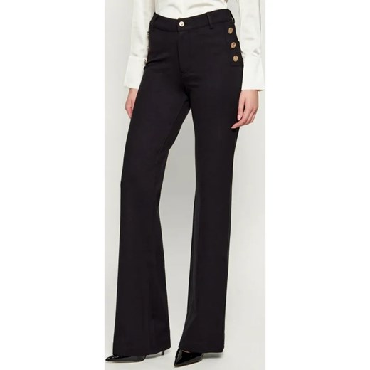 GUESS Spodnie CHRISSY | flare fit ze sklepu Gomez Fashion Store w kategorii Spodnie damskie - zdjęcie 186334968