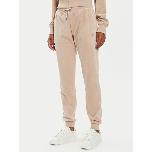 Guess Spodnie dresowe V3BB27 KBXI2 Beżowy Regular Fit ze sklepu MODIVO w kategorii Spodnie damskie - zdjęcie 186450428