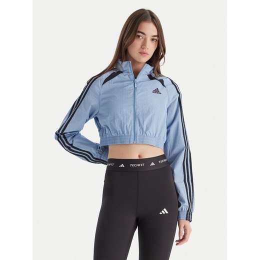 adidas Bluza Teamgeist adicolor JZ8277 Błękitny Slim Fit ze sklepu MODIVO w kategorii Bluzy damskie - zdjęcie 186450469