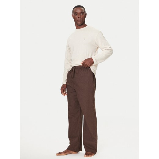 Tommy Hilfiger Spodnie materiałowe UM0UM03689 Brązowy Relaxed Fit ze sklepu MODIVO w kategorii Spodnie męskie - zdjęcie 186492686