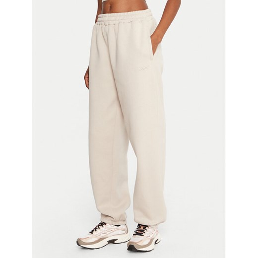 Reebok Spodnie dresowe Reebok X Ewa Chodakowska RK25304CCW Beżowy Regular Fit ze sklepu MODIVO w kategorii Spodnie damskie - zdjęcie 186521829
