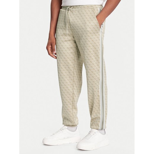 Guess Spodnie dresowe Z5BB19 K2042 Beżowy Regular Fit ze sklepu MODIVO w kategorii Spodnie męskie - zdjęcie 186555729