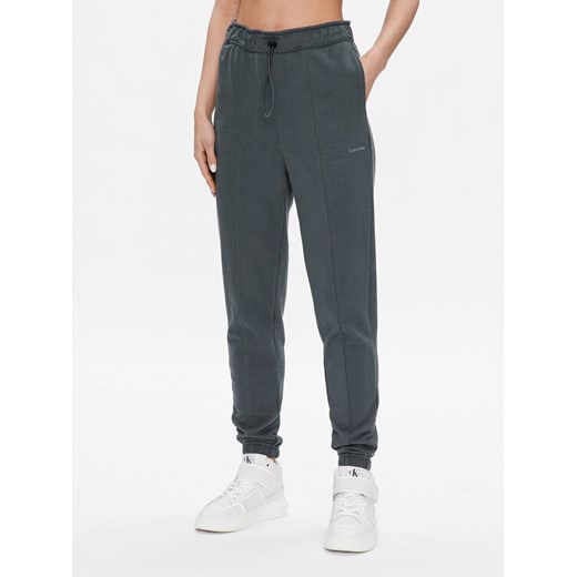 Calvin Klein Performance Spodnie dresowe 00GWS3P605 Zielony Regular Fit ze sklepu MODIVO w kategorii Spodnie damskie - zdjęcie 186571968