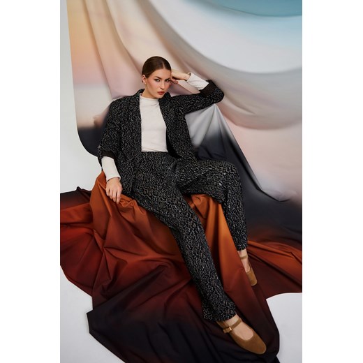 Spodnie w panterkę czarne ze sklepu Moodo.pl w kategorii Spodnie damskie - zdjęcie 186646007