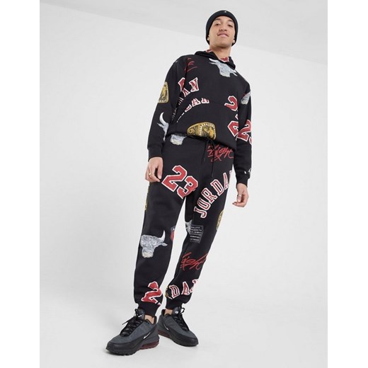 JORDAN SPODNIE M J ESS AOP FLC PANT ze sklepu JD Sports  w kategorii Spodnie męskie - zdjęcie 186684179
