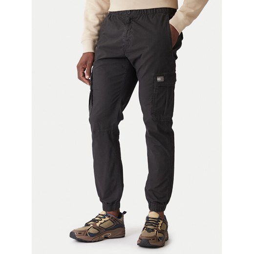 Tommy Jeans Spodnie materiałowe DM0DM22003 Szary Regular Fit ze sklepu MODIVO w kategorii Spodnie męskie - zdjęcie 186732425