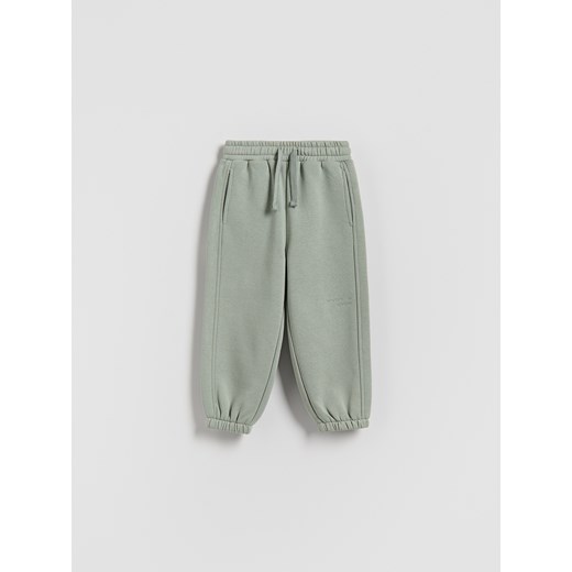 Reserved - Ocieplane spodnie jogger - jasnozielony - id: 154FI-70X - marki Reserved - 186736919 Reserved - Ocieplane spodnie jogger - jasnozielony ze sklepu Reserved w kategorii Spodnie chłopięce - zdjęcie 186736919