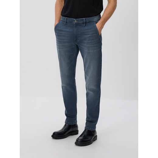 Reserved - Jeansy slim fit z efektem sprania - granatowy Reserved 34 Reserved