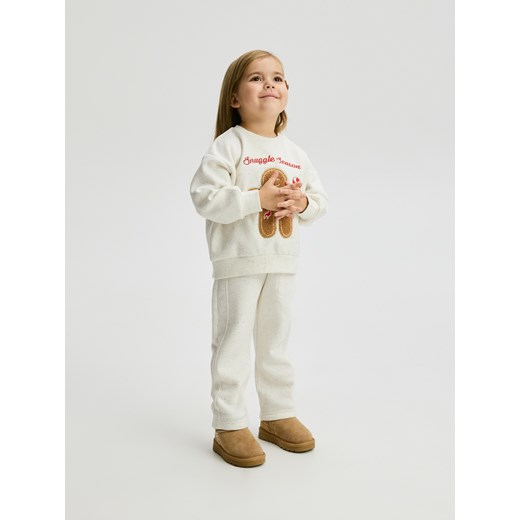 Reserved - Bluza ze świąteczną aplikacją - złamana biel Reserved 92 (1 Reserved