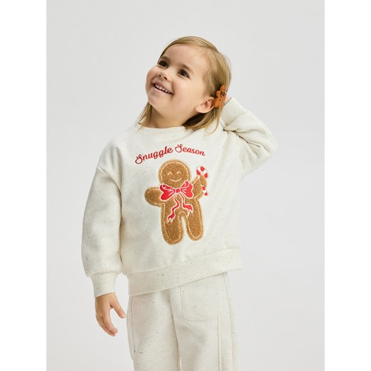 Reserved - Bluza ze świąteczną aplikacją - złamana biel - id: 598GT-01M - marki Reserved - 186800907 Reserved - Bluza ze świąteczną aplikacją - złamana biel ze sklepu Reserved w kategorii Bluzy dziewczęce - zdjęcie 186800907